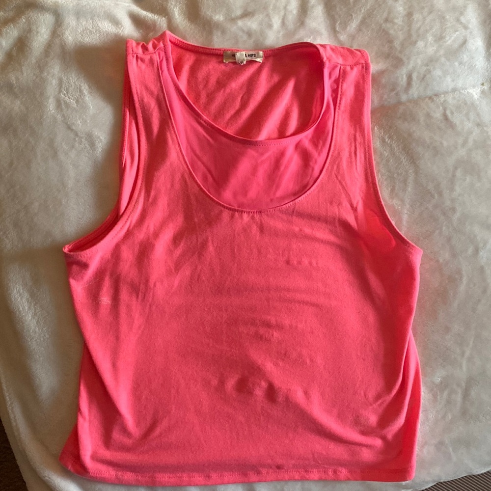 Neon pink size large. Fit between medium-large.
